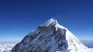 What Is the Temperature of Mount Everest: Extreme Cold at the World's Highest Peak Mount Everest, the world's highest peak, experiences extreme temperatures that challenge even the most seasoned climbers. The temperature at the summit of Mount Everest can plummet to -60°C (-76°F) in winter and reach a maximum of -19°C (-2°F) in summer. These frigid conditions are a result of the mountain's extreme altitude and its location in the Himalayas. The temperature on Mount Everest varies significantly depending on the season, time of day, and specific location on the mountain. As climbers ascend, they encounter progressively colder temperatures due to the decrease in air pressure and oxygen levels. This harsh environment requires extensive preparation and specialized equipment for those attempting to reach the summit. Understanding the temperature dynamics of Mount Everest is crucial for climbers, researchers, and anyone interested in extreme environments. The mountain's unique climate influences its ecosystem, glacial patterns, and the challenges faced by expedition teams. These factors contribute to the ongoing fascination with Earth's highest point and its role in scientific research and mountaineering achievements. Temperature Variables of Mount Everest Mount Everest experiences extreme temperature fluctuations influenced by altitude, seasons, and daily cycles. These factors create a complex and harsh climate on the world's highest peak. Elevation Impact on Temperature The temperature on Mount Everest decreases significantly with increasing altitude. For every 100 meters of elevation gain, the temperature drops by approximately 0.65°C (1.2°F). This lapse rate results in dramatically colder conditions at the summit compared to the base. At the peak, temperatures can plummet to -60°C (-76°F) in winter. Even during the warmest months, summit temperatures rarely rise above -20°C (-4°F). The extreme cold at high altitudes poses significant challenges for climbers and necessitates specialized gear for survival. Seasonal Temperature Differences Mount Everest's temperatures vary considerably between seasons. The warmest period occurs from May to October, coinciding with the monsoon season. During these months, average temperatures at base camp (5,364 meters) range from -6°C to 3°C (21°F to 37°F). July is typically the warmest month. Winter, from December to February, brings the coldest conditions. Summit temperatures can drop below -60°C (-76°F), with wind chill factors making it feel even colder. Spring (March-May) and autumn (September-November) offer more moderate temperatures, making these the preferred seasons for climbing expeditions. Daily Temperature Variations Mount Everest experiences significant temperature swings within a 24-hour period. These daily fluctuations are most pronounced at higher altitudes. Daytime temperatures can be 5°C to 10°C (9°F to 18°F) warmer than nighttime temperatures. This difference is due to direct solar radiation during the day and rapid heat loss at night. The most extreme temperature changes occur during clear weather conditions. Cloud cover can moderate these variations by trapping heat. Climbers must be prepared for these rapid temperature shifts, adjusting their gear and climbing strategies accordingly. Measuring and Recording Temperatures Accurate temperature measurements on Mount Everest require specialized equipment and meticulous data collection. Scientists employ various technologies and methods to capture the mountain's extreme conditions. Technologies in Use Automated weather stations placed at different elevations on Everest continuously monitor temperatures. These stations use thermometers designed to withstand harsh conditions, including intense cold and high winds. Satellite-based remote sensing technology also plays a crucial role in measuring surface temperatures across large areas of the mountain. Climbers and researchers often carry portable thermometers and data loggers. These devices record temperature fluctuations during ascents and at specific locations. Some expeditions use infrared thermography to capture thermal images, revealing temperature patterns on the mountain's surface. Historical Temperature Data Temperature records for Mount Everest date back to the early 20th century. Early explorers used basic thermometers to record spot measurements during their climbs. The first systematic temperature recordings began in the 1950s with the establishment of weather stations near the base camp. Long-term data sets have been compiled from various sources, including weather balloons, aircraft measurements, and satellite observations. These records show significant temperature variations across different seasons and altitudes on the mountain. Recent efforts focus on creating comprehensive climate models for Everest. Scientists analyze historical data alongside current measurements to understand temperature trends and predict future changes in the mountain's climate.